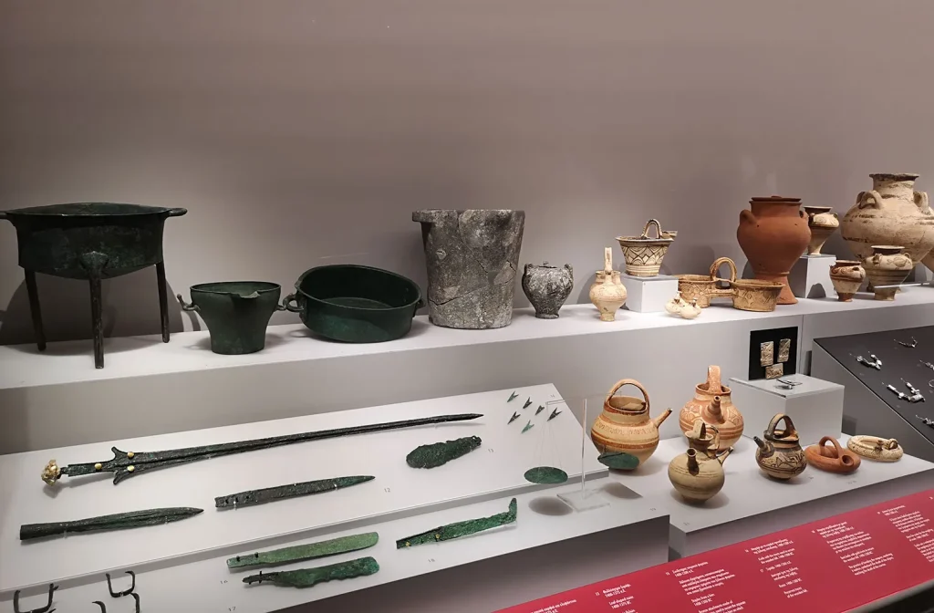 exhibits of clay vessels and metal lances