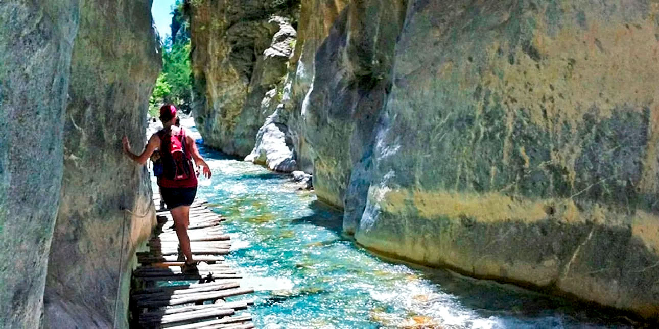 person crosses sideroportes in Samaria george